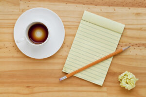 Empty,Espresso,Coffee,Cup,,Notepad,And,Pencil,On,Pine,Wood